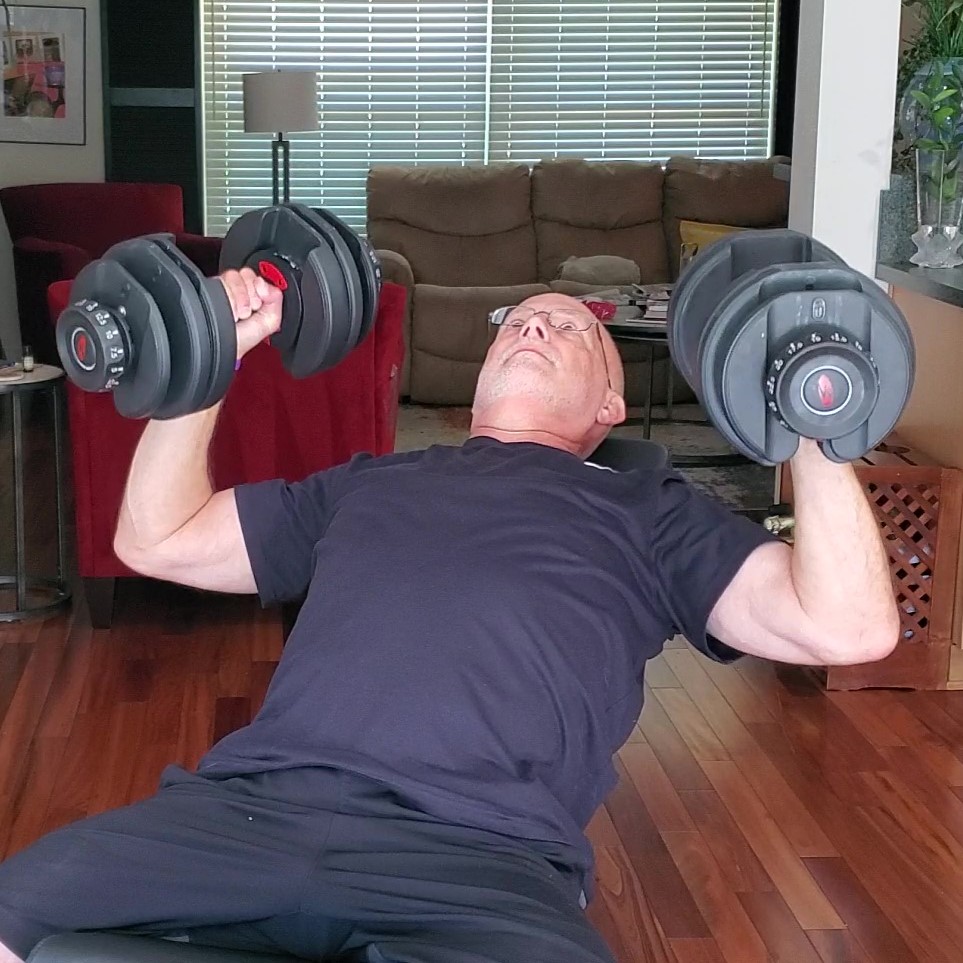 Demonstration of the dumbbell bench press for building muscle after 60