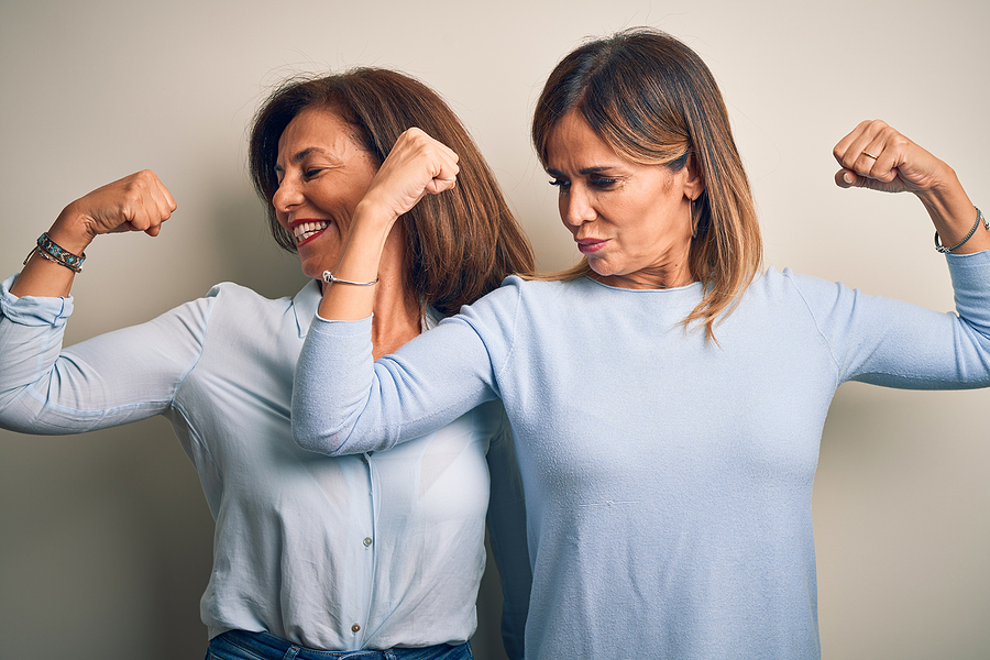 Heavy lifting older women showing off their muscles